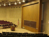 Front of auditorium, including podium.