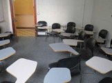 Photo of locy Hall Room Number 213 showing chairs