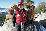 Linda Smith Faulkner ’67 of Diamond Springs, Calif., started her 43rd year on the ski patrol at Sierra-at-Tahoe Resort in November, when she stopped to pose with two certified avalanche rescue dogs, Hunter and Kopa, and new puppy trainee Spooner. 