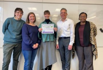 The OUR Team posing with a Green Office Certificate