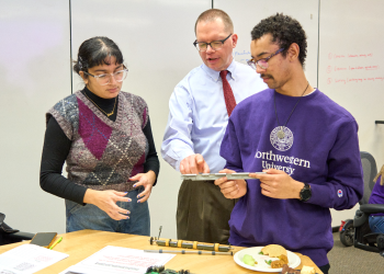 students and a professor studying