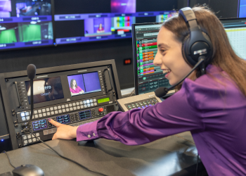 student working with recording equipment