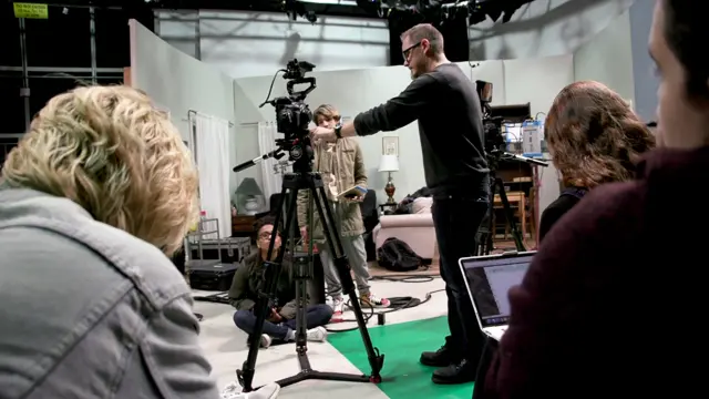 instructor adjusting camera