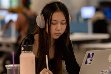 student at laptop studying