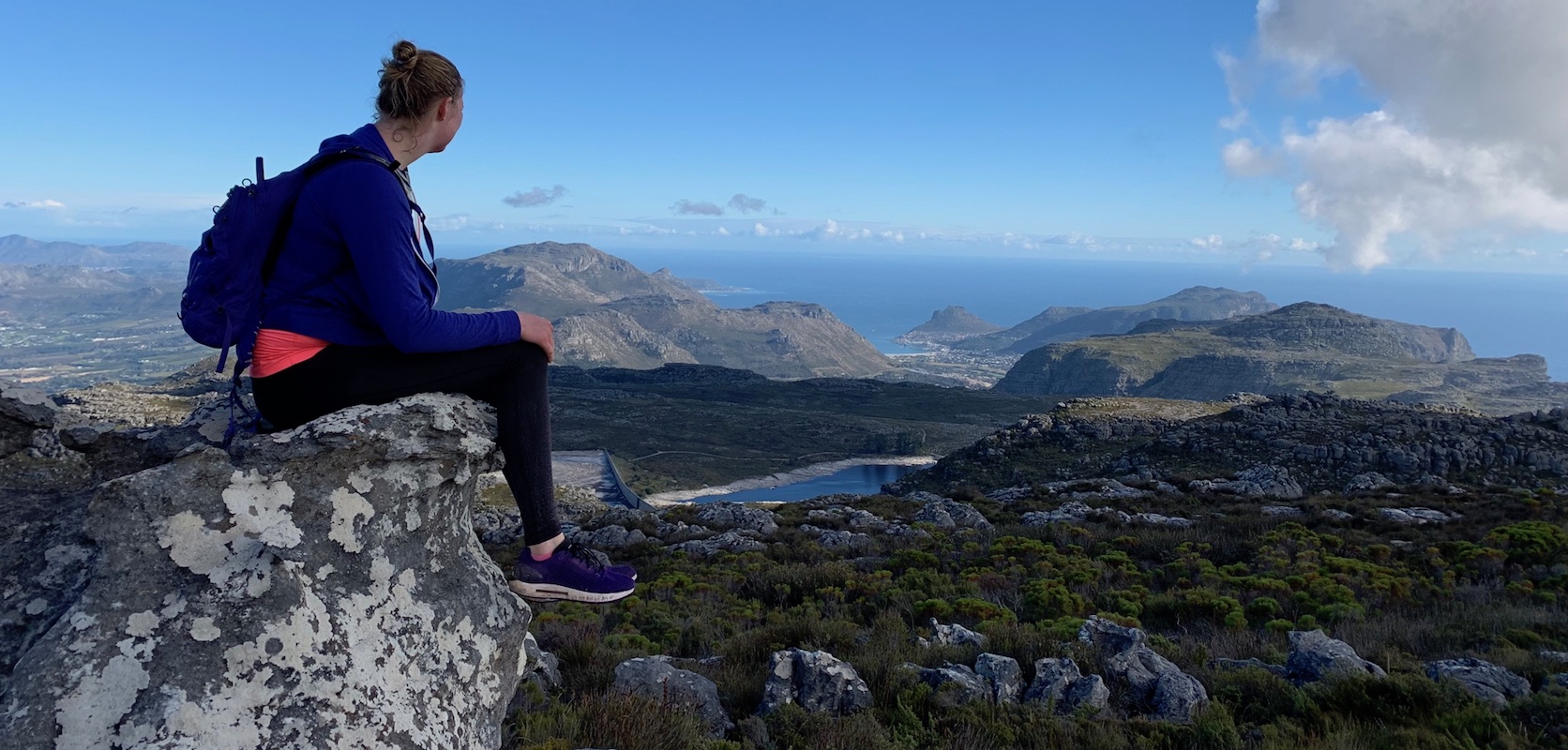 Student overlooking ocean and mountain views in Capetown, South Africa