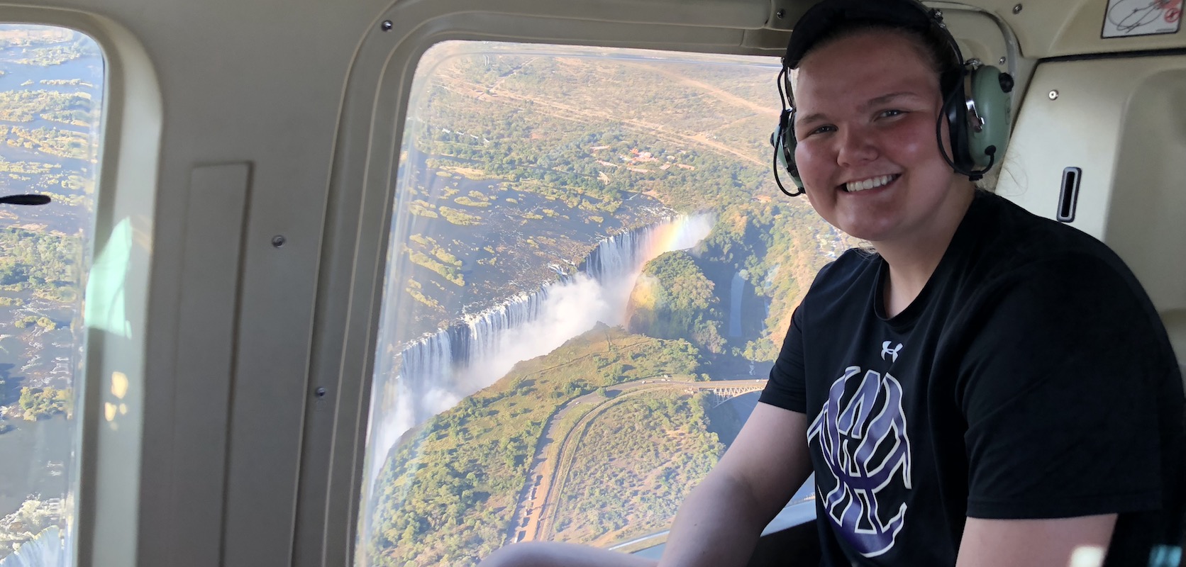 Student in helicopter over Victoria Falls, Zimbabwe