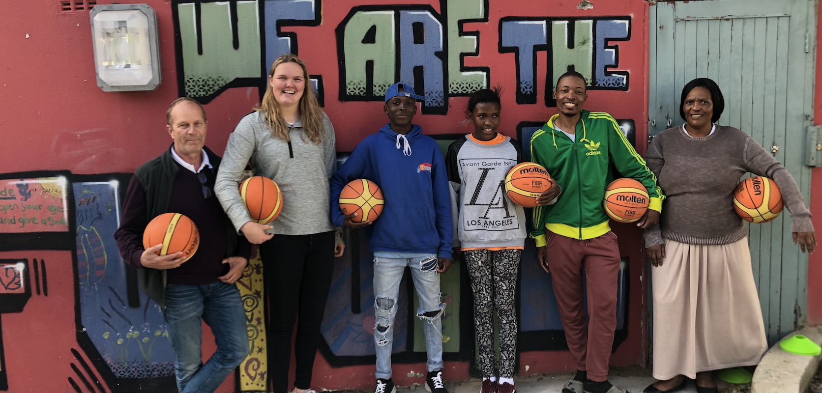 Student with basketball players in South Africa