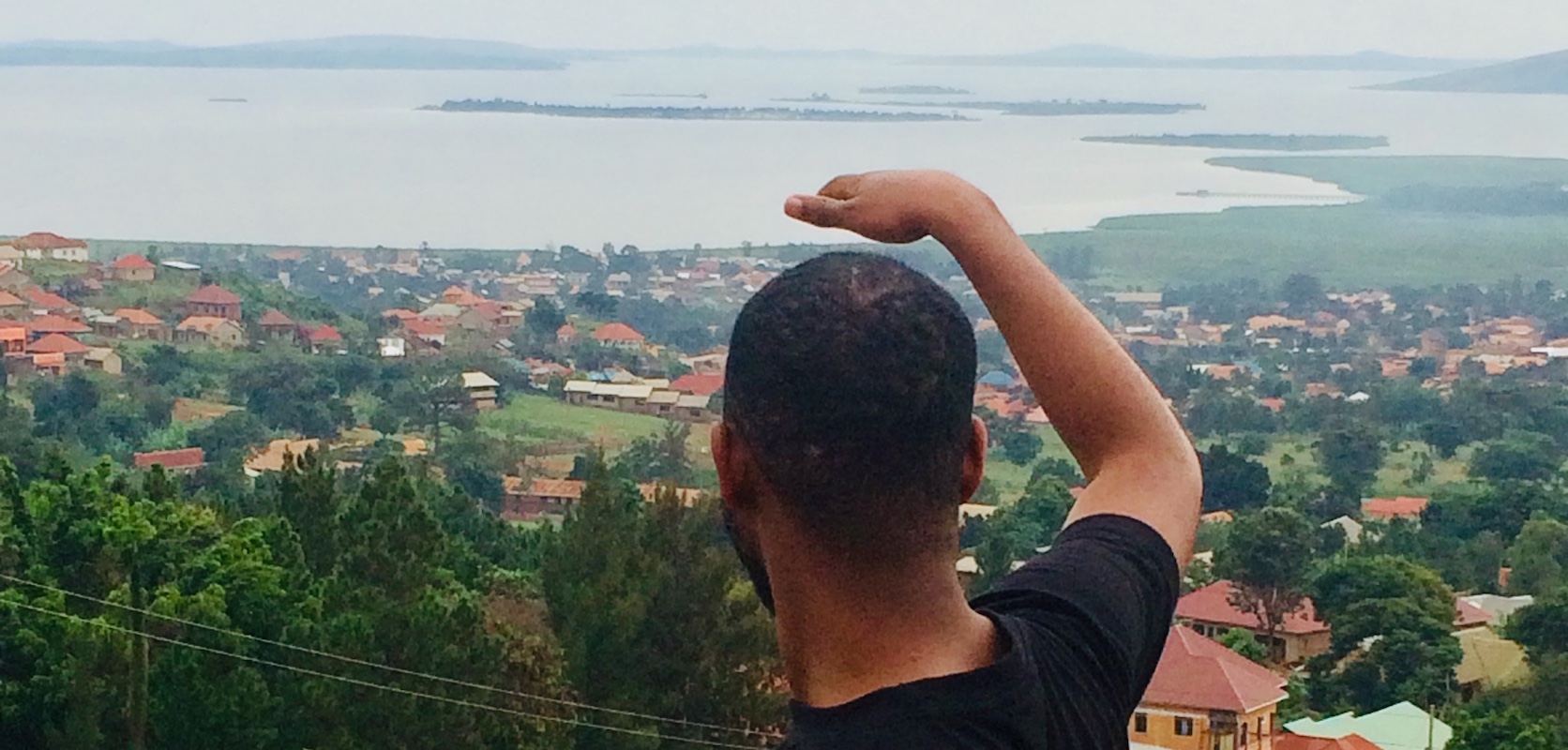 Student enjoys view of lake in Uganda
