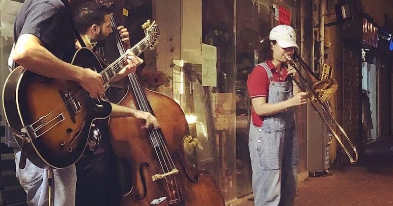 Student plays trombone with local musicians in Jerusalem, Israel