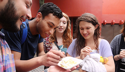 students eating street food