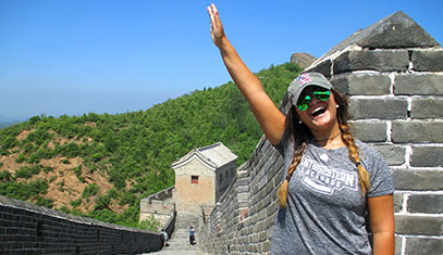 student waving