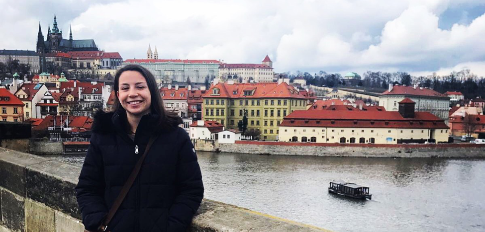 Student studying abroad in Prague with view of the city
