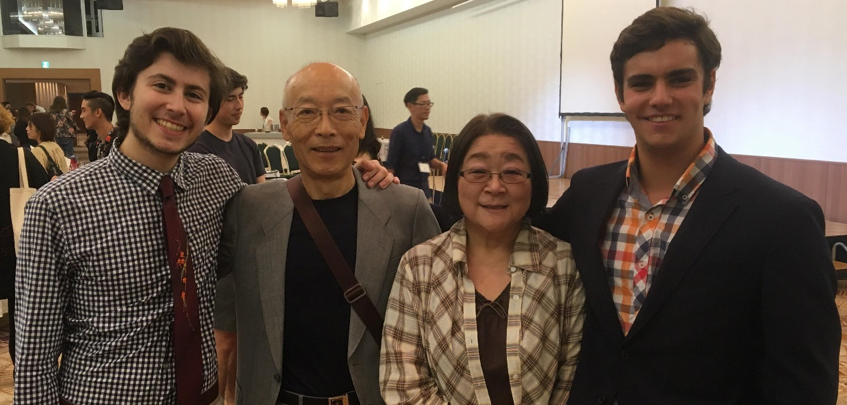 Student smiling with Japanese host parents and housemate