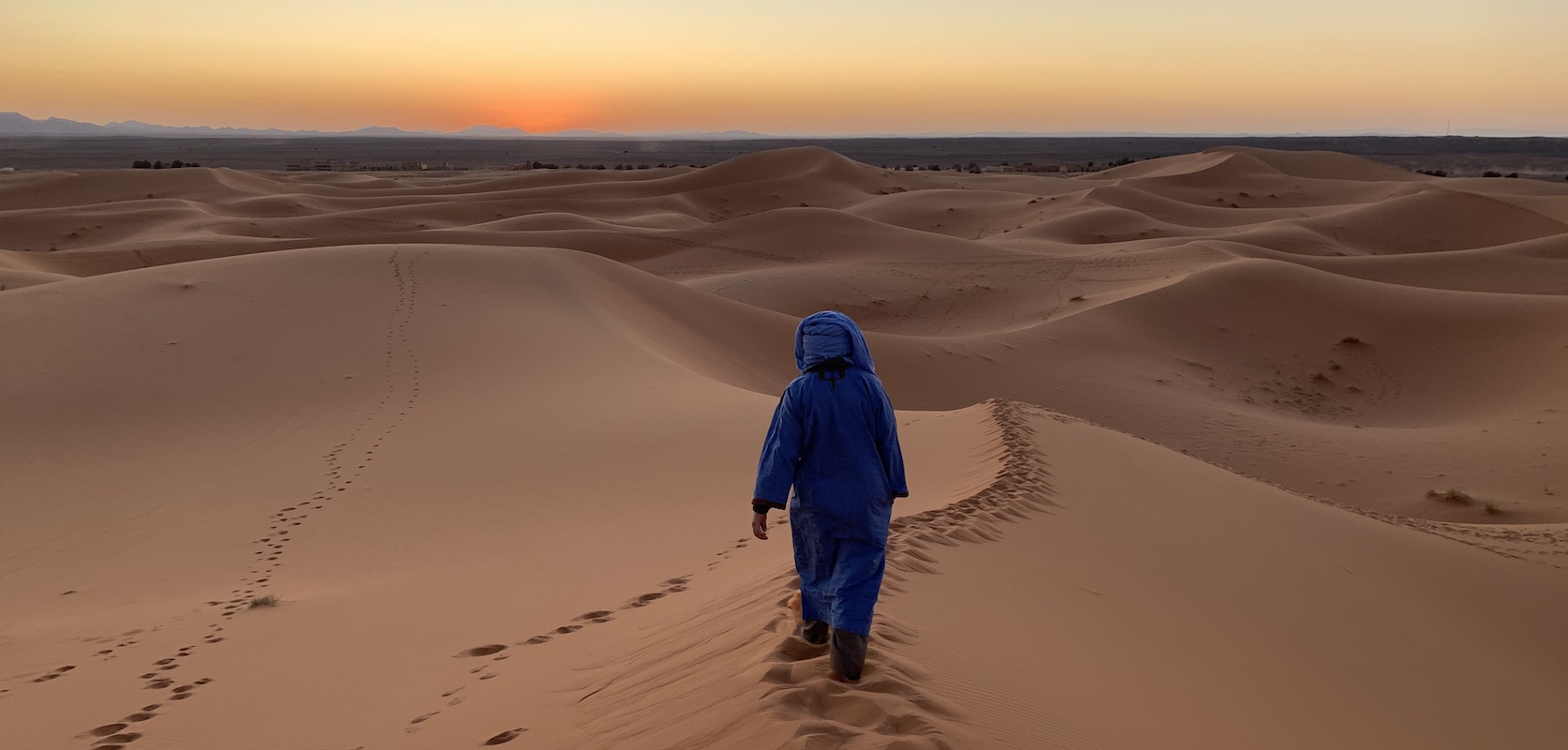 Person walking in the desert in Morocco