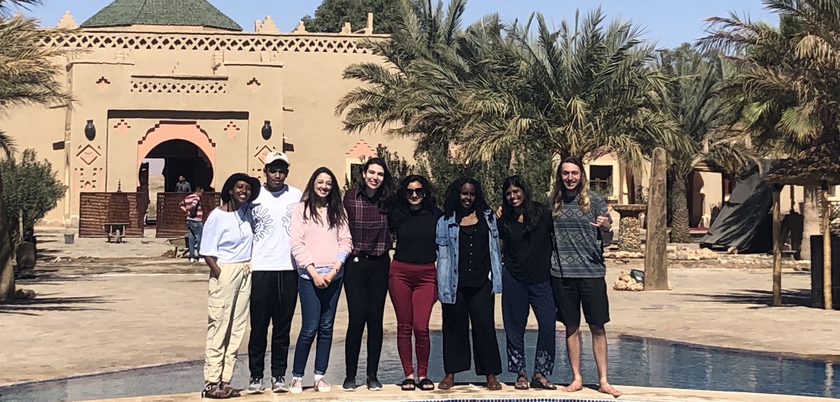 A group of students pose for a picture outside in Morocco
