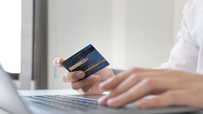 Person holding credit card