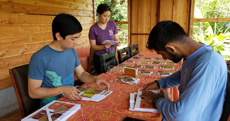 Students preparing seed packets in Costa Rica as they learn about global community-based development work.