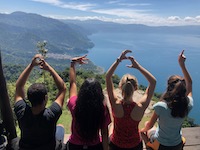 My friends and I attempting to spell out GESI as we overlook Lake Atitlán-Guatemala 