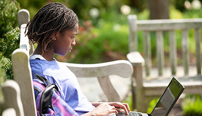 Girl looking at a laptop