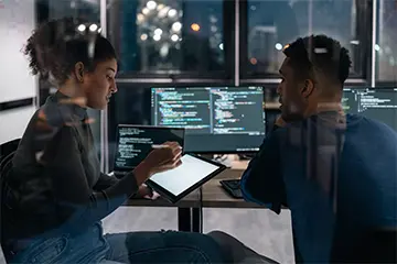 two people working on computer together