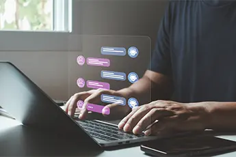 hands typing on a laptop