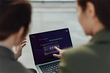 two people working on a laptop