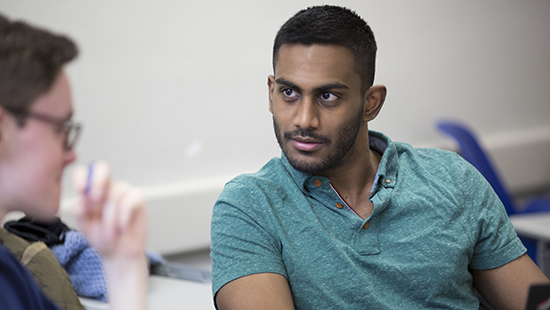 two students talking having a discussion