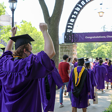 seniors march back through the arch