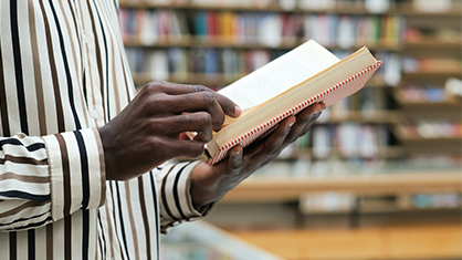 Person with book in their hand