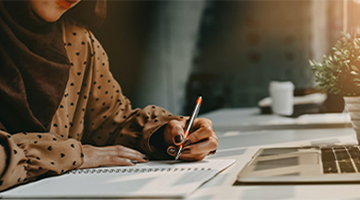 Photo of Person writing