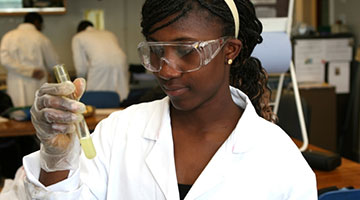 student with a beaker