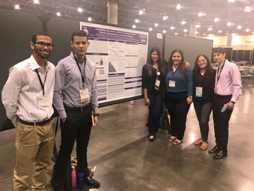 Students presenting a poster ar ABRCMS