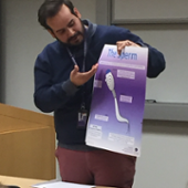 Student holding a poster