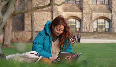 student with laptop at deering