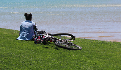student looking at the lake