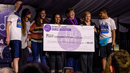 Students Giving the Check to the Charity at Dance Marathon