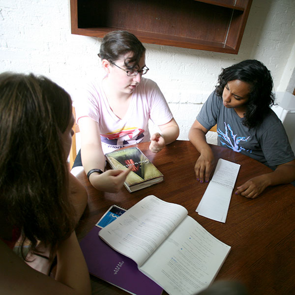 students researching together at a table
