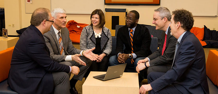 Images of professionals in a meeting.