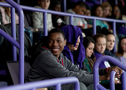 Students sitting in bleachers.