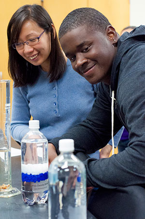Image of two students in a chemistry lab.