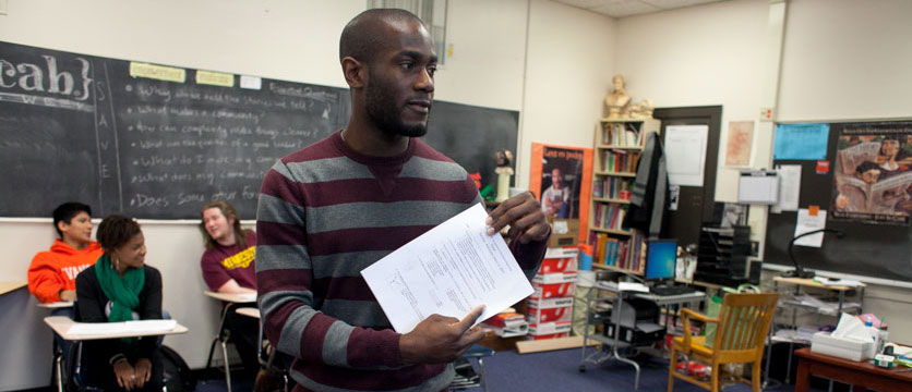 Image of an instructor teaching students in a classroom.