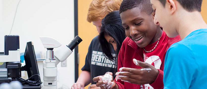 Image of children working in a science lab.