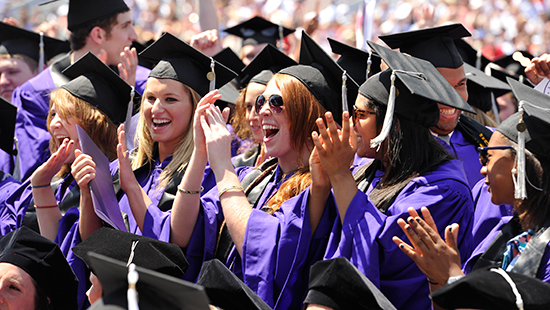 graduates clapping at commencement