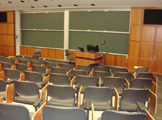 Seating facing podium and blackboards.