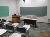 View of podium and blackboards.