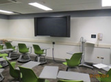 View of chairs and wall-mounted monitor.