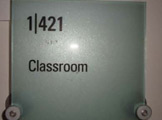 Photo of Frances Searle 1-421 showing label outside the room