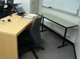 Photo of Frances Searle 2-378 showing a desk and a chair