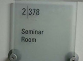 Photo of Frances Searle 2-378 label outside the room