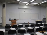 Photo of Frances Searle 2-407 showing three whiteboards and chairs